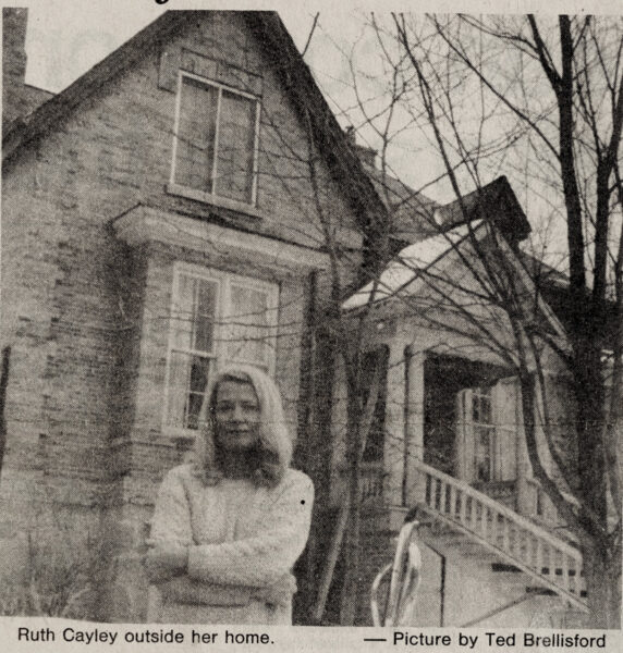 newspaper clipping image of Ruthe Cayley in front of Homer Watson House